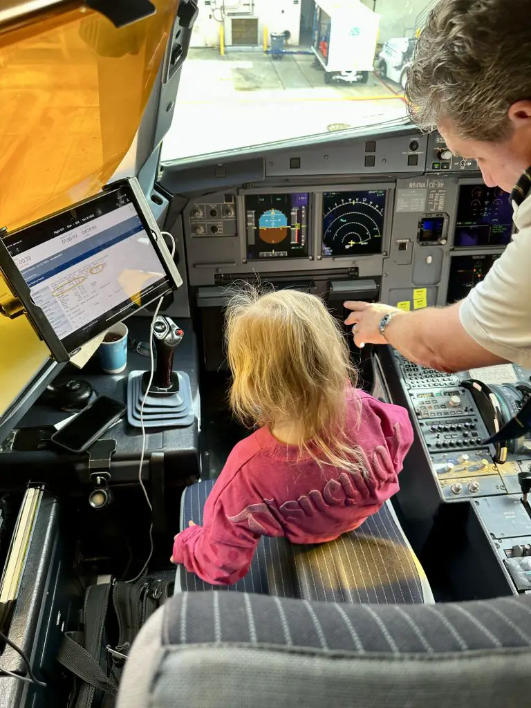 Orange County Airport Best Airport to fly into Disneyland child sitting in pilots seat