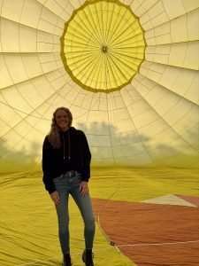 Lady standing inside balloon at media preview